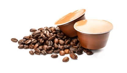 Coffee capsules with beans on white background