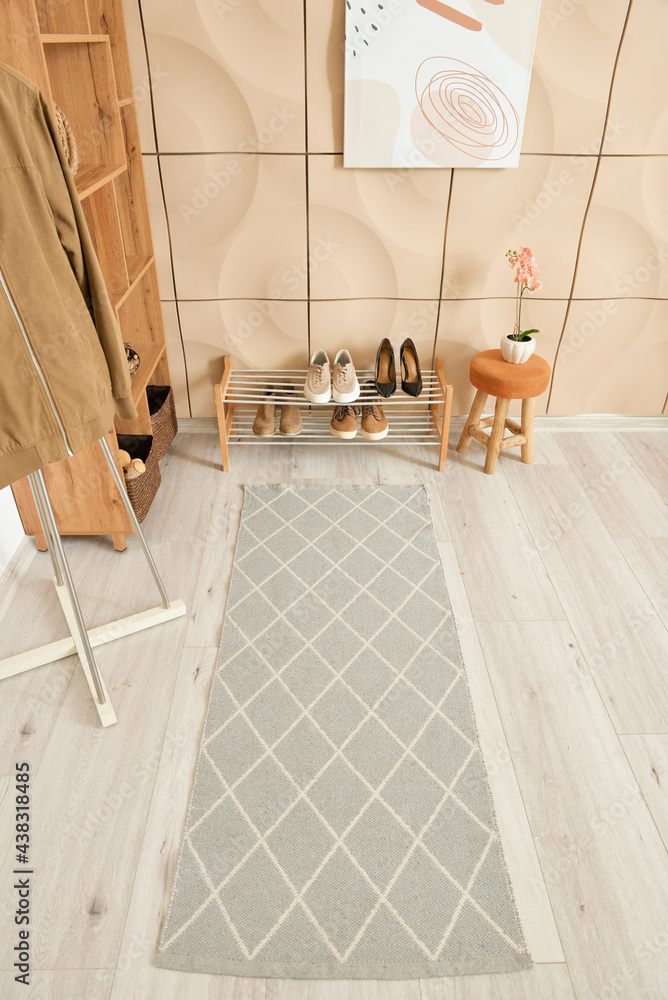 Stylish rug in interior of modern hallway