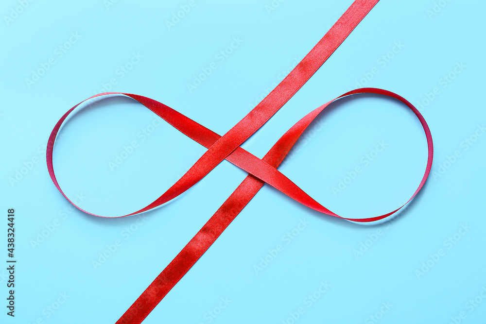 Red ribbon on color background
