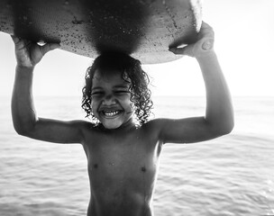 Wall Mural - Little kid playing at the beach