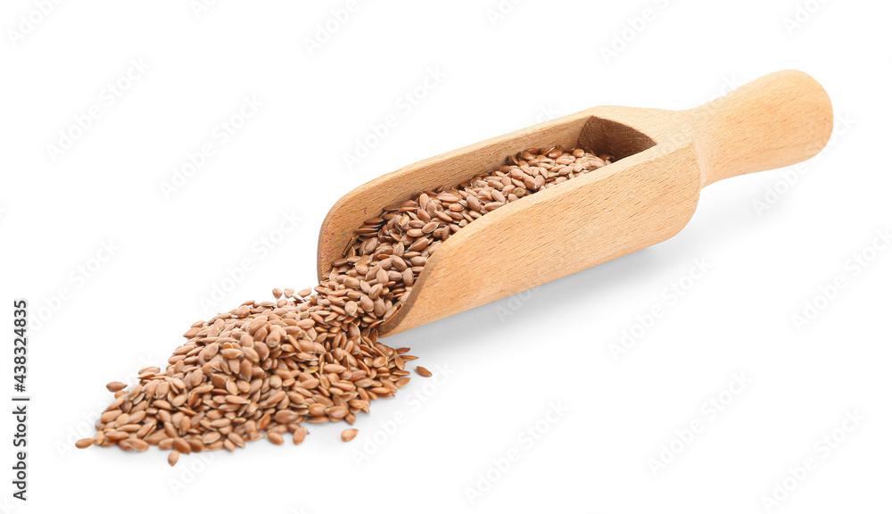 Scoop with flax seeds on white background