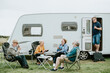 Group of senior people gathering outside a trailer