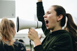 © Rawpixel.com - Female activist shouting on a megaphone