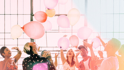 People playing with balloons at a party wallpaper