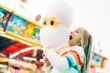 © ADDICTIVE STOCK - Little girl has fun at the fair with lights and eats sweet cotton.