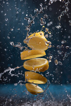 Splash Of Sliced Lemon With Water Drops