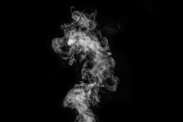 Perfect mystical curly white steam or smoke isolated on black background. Abstract background fog or smog