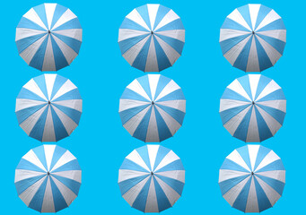 Wall Mural - Collection of white and cyan umbrella isolated on light cyan background.