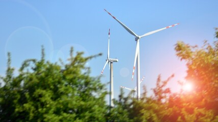 Wind mills during bright summer day