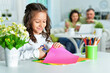 © aletia2011 - Cute little girl is cutting color paper