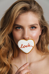 Poster - Half-naked white ginger woman posing with heart biscuit