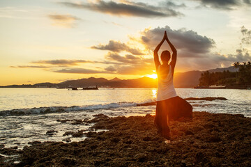 Sticker - Woman doing yoga by the sea