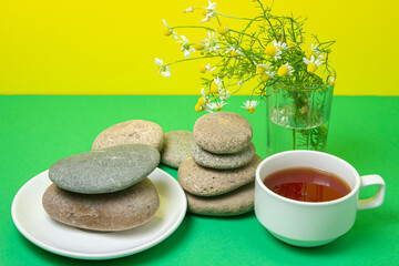 Wall Mural - Creative photography of tea on a colored background. A cup of soothing tea.