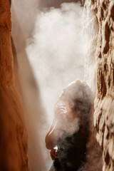 Wall Mural - Beautiful woman resting in the desert