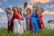 © Ihor - Ukrainian girls in national costumes lead a round dance on the seashore in summer