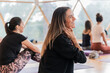 © ADDICTIVE STOCK - Cheerful woman touching neck and looking away during practicing yoga