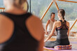 © ADDICTIVE STOCK - People doing yoga on yoga mats in domed hall