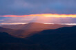 Cascading light shining down into the Blue Ridge Mountains along the Blue Ridge Parkway near Asheville, North Carolina.