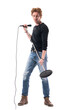 © sharplaninac - Macho handsome rocker male singer carrying microphone with stand looking down. Full body length isolated on white background.