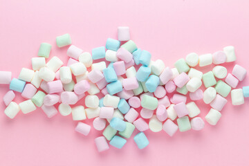 Colorful marshmallows background close up. Marshmallows on pink background