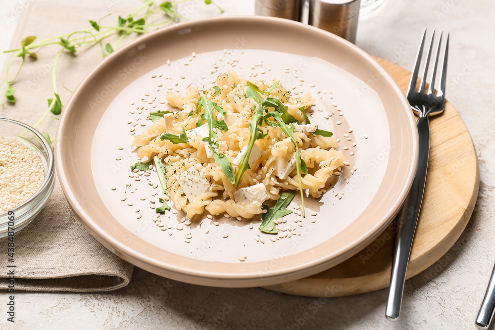 Plate with tasty pasta on table, closeup