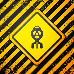 Poster - Black Nuclear bomb icon isolated on yellow background. Rocket bomb flies down. Warning sign. Vector