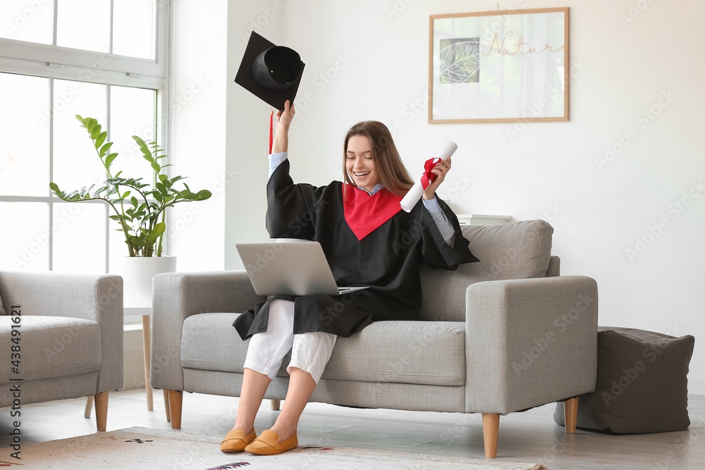 Happy female student on her graduation day at home. Concept of studying online