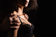 Cropped view of man touching shoulders of african american girlfriend in bra isolated on black