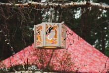 Decorative Handmade Wooden Lantern With The Image Of An Owl Hanging On A Tree In Nature In Summer