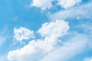 Wall Mural - blue sky with soft fluffy clouds. natural textured sky background.