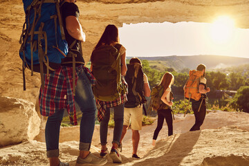 Wall Mural - hiking and traveling together concept. group of travelers hikers hiking in natural mountaints outdoo