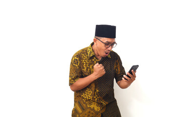 Wow and shocked face of Asian man while looking at his cellular phone. Isolated on white background