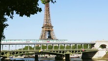 Metro Train Over Bir-Hakeim Bridge Between Two Stations Bir-Hakeim And Passy Near The Eiffel Tower Over The River Seine In Paris France In Sunny Day