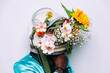 © oneinchpunch - fine art concept with man wearing a space helmet and flowers composition