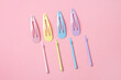 Group of colorful pastel color Hair Clips on Pink Background, Styled Shot,modern accessories for hair