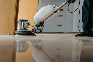 Sticker - worker cleaning floor with machine