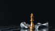 © SEVENNINE_79 - Gold king winner surrounded with silver chess pieces on chess board game competition.concept strategy, leadership and success business.
