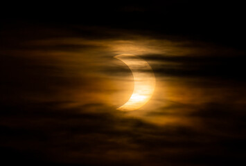 Wall Mural - annular solar eclipse through the morning clouds - june 10, 2021, rural kanata, ontario, canada