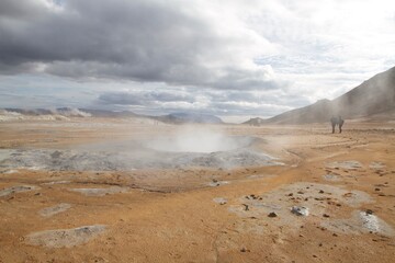 Iceland, Myvatn area, solfataras, geothermal, sand, desert area with boiling water and smoke, tourists