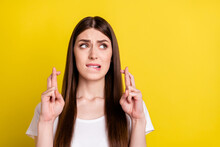 Photo Of Young Girl Nervous Bite Lips Teeth Crossed Fingers Ask Beg Pray Wish Hope Luck Isolated Over Yellow Color Background