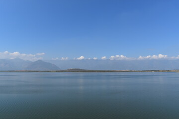 Naklejka na meble lake beside the mountains along with the clouds
