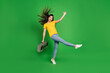 © deagreez - Full length body size photo girl with long brunette hair keeping boom box smiling isolated bright green color background
