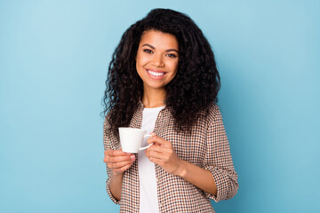 Sticker - Photo of charming shiny dark skin woman dressed checkered shirt smiling drinking coffee isolated blue color background