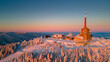Winter sunrise on Lysa Hora mountain. Th highest peak of Beskydy mountains in the east part of Czech Republic. High quality aerial panorama.