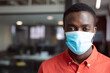 © wavebreak3 - Portrait of african american businessman wearing face mask looking to camera in office