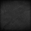 © peekeedee - Dark grey black slate background or texture.