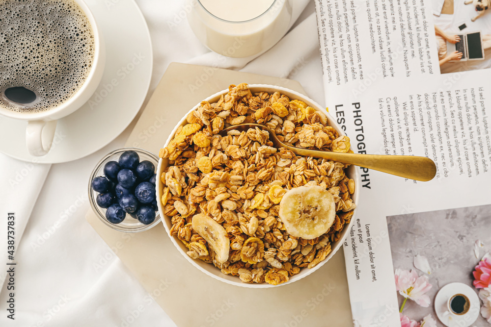 Bowl with tasty granola on table