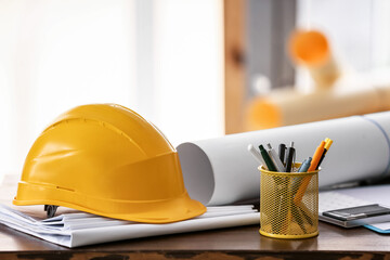 Hardhat of engineer on table in office