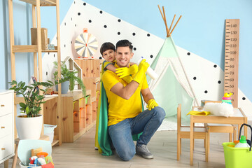 Poster - Father and son with cleaning supplies having fun at home