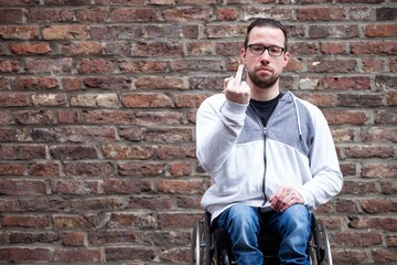 Poster - man in wheelchair giving the middle finger